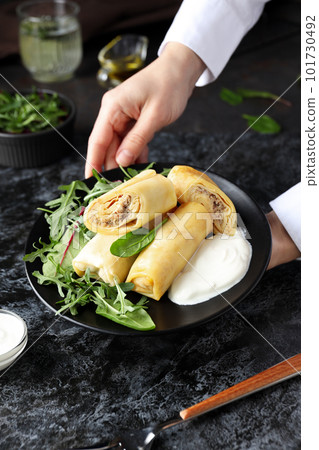 Concept of tasty food, thin pancakes with filling 101730492