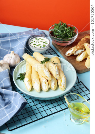 Concept of tasty food, thin pancakes with filling 101730504