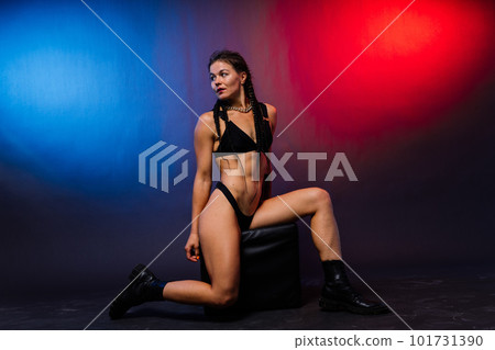 Beautiful seductive woman in black lingerie. Carefree model with perfect body. Hot tanned female Beautiful seductive woman in black lingerie. Carefree model with perfect body. Hot tanned female 101731390