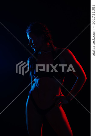 Beautiful seductive woman in black lingerie. Carefree model with perfect body. Hot tanned female Beautiful seductive woman in black lingerie. Carefree model with perfect body. Hot tanned female 101731392