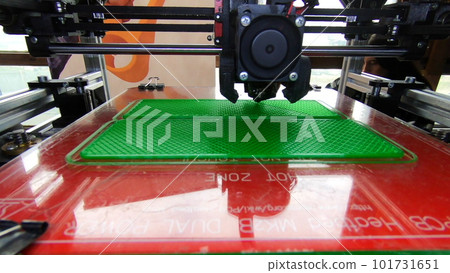 3D printer. 3d printer printing close-up. Molten plastic flowing out of extruder and forming prototype model. New modern additive technologies for printing 3D printer. Electronic device for modeling. 3D printer. 3d printer printing close-up. Molten plastic flowing out of extruder and forming prototype model. New modern additive technologies for printing 3D printer. Electronic device for modeling. 101731651