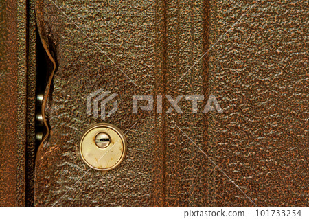 large durable lock is broken in a metal door close-up large durable lock is broken in a metal door close-up 101733254