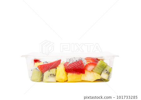 Fruit salad of pineapple, strawberry, kiwi and pitahaya in a plastic container on a white background. Fruit salad of pineapple, strawberry, kiwi and pitahaya in a plastic container on a white background. 101733285