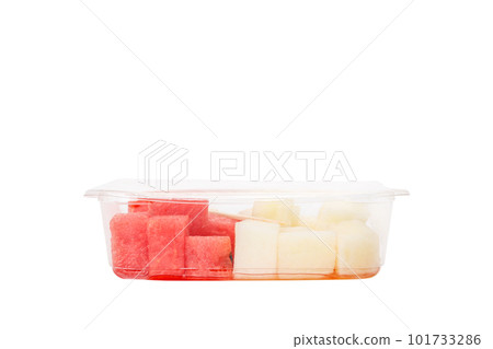 Fruit salad with watermelon and melon in a plastic container on a white background. Fruit salad with watermelon and melon in a plastic container on a white background. 101733286