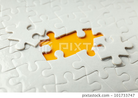 White puzzles without two puzzles on orange background 101733747