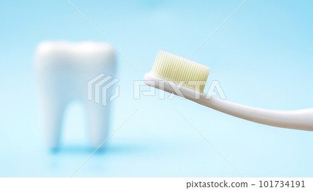 Toothbrush and tooth on a blue background. Toothbrush and tooth on a blue background. 101734191