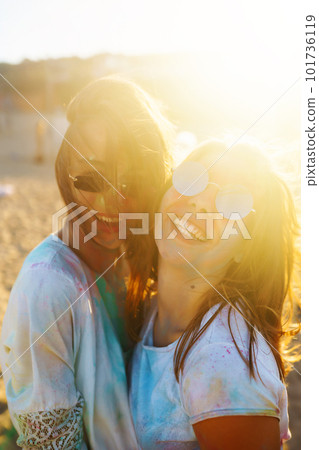 Two beautiful girls have a great time on Holi festival. Spring Break Beach Party. Friendship, Leisure, Vacation 101736119