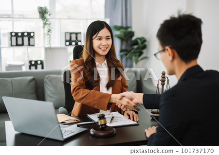 justice and law concept.passing bribe money in the envelop at office. businesswoman hand taking bribe money from male. 101737170