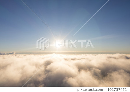 Aerial view White clouds in blue sky. Top. View from drone. Aerial bird's eye. Aerial top view cloudscape. Texture of clouds. View from above. Sunrise or sunset over clouds 101737451