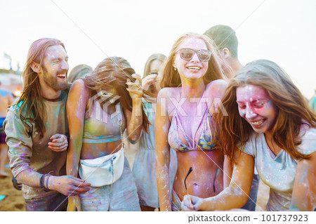 Teenagers Friends have fun at the holi festival. Beach Party. Celebrating traditional indian spring holiday. Teenagers Friends have fun at the holi festival. Beach Party. Celebrating traditional indian spring holiday. 101737923