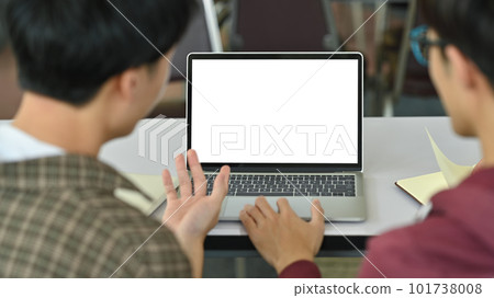 Back view of two student using laptop, working together on academic project. Education, Learning and technology concept Back view of two student using laptop, working together on academic project. Education, Learning and technology concept 101738008
