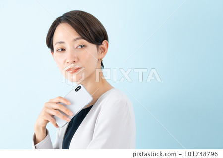 Business woman with a smartphone Business woman with a smartphone 101738796