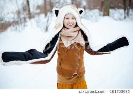 smiling child outdoors in city park in winter having fun time smiling child outdoors in city park in winter having fun time 101738985