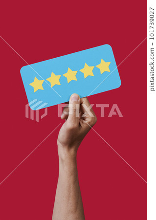 man holding a blue sign with five stars 101739027