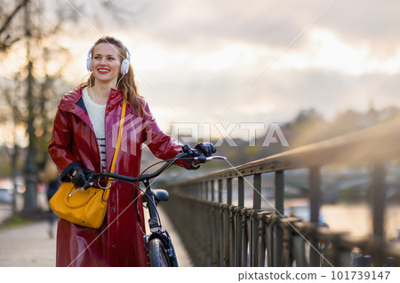 woman listening to music and walking outside in city woman listening to music and walking outside in city 101739147