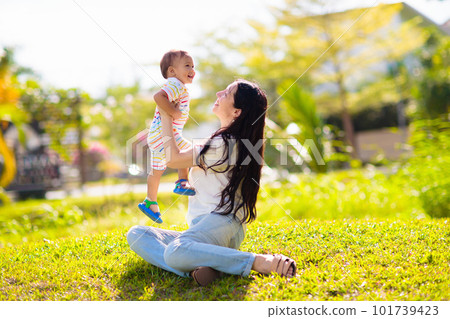 Mother and son in sunny park. 101739423
