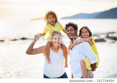 Family walking on tropical beach. Family walking on tropical beach. 101739434