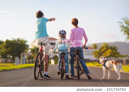 Family on bicycle. Parents and kid ride bike. 101739793