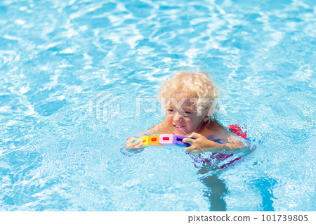 Child learning to swim. Kids in swimming pool. Child learning to swim. Kids in swimming pool. 101739805