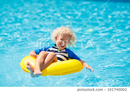 Child in swimming pool. Kids swim. Water play. 101740002