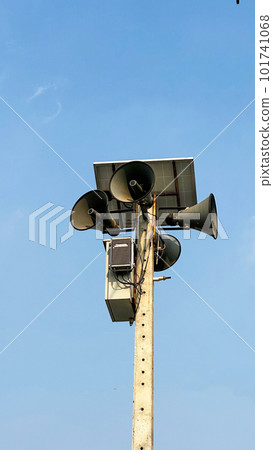 Bull horn speakers installed on the top of concrete pole 101741068