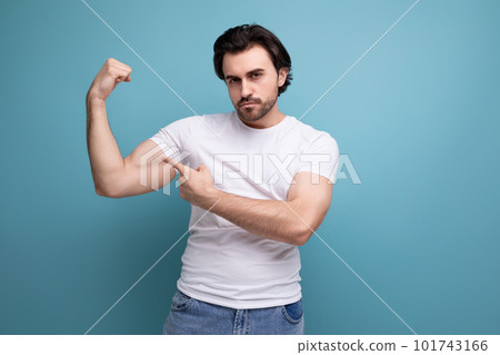 strong muscular young man in white t-shirt on studio background with copyspace strong muscular young man in white t-shirt on studio background with copyspace 101743166