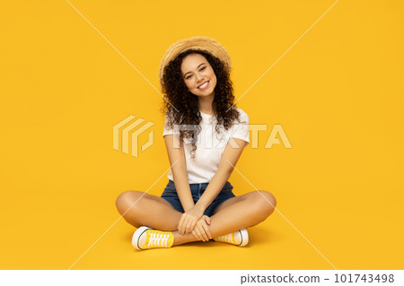Young woman in casual summer wearing on yellow background Young woman in casual summer wearing on yellow background 101743498