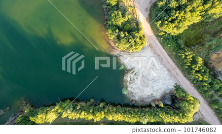 Aerial view over beautiful turquoise mountain lake and green forest. Spring in the mountains. Green Aerial view over beautiful turquoise mountain lake and green forest. Spring in the mountains. Green 101746082