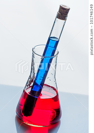 Medical tubes with liquid stand on mirror table. Chemical and laboratory analyses. Experiments and Medical tubes with liquid stand on mirror table. Chemical and laboratory analyses. Experiments and 101746149