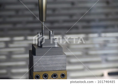The CNC milling machine finish cutting the graphite electrode parts with solid ball end mill. The CNC milling machine finish cutting the graphite electrode parts with solid ball end mill. 101746485