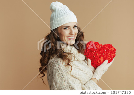 happy trendy woman isolated on beige background with red heart happy trendy woman isolated on beige background with red heart 101747350