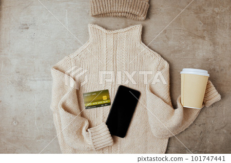 winter flat lay with hat, coffee cup and smartphone winter flat lay with hat, coffee cup and smartphone 101747441