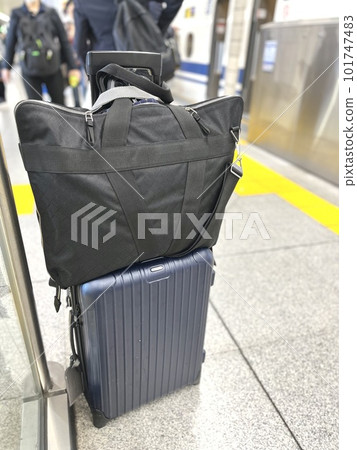 A suitcase used by a trading company man on a domestic business trip A suitcase used by a trading company man on a domestic business trip 101747483