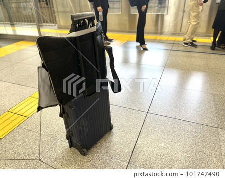 A suitcase used by a trading company man on a domestic business trip A suitcase used by a trading company man on a domestic business trip 101747490