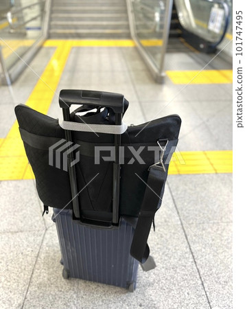 A suitcase used by a trading company man on a domestic business trip A suitcase used by a trading company man on a domestic business trip 101747495