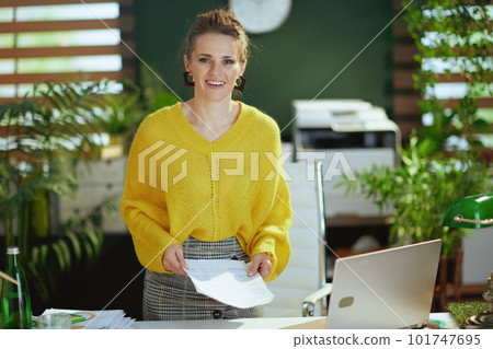 business owner woman in green office working with documents 101747695
