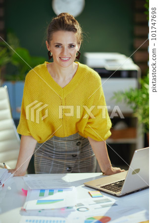 business owner woman in green office working with documents business owner woman in green office working with documents 101747698
