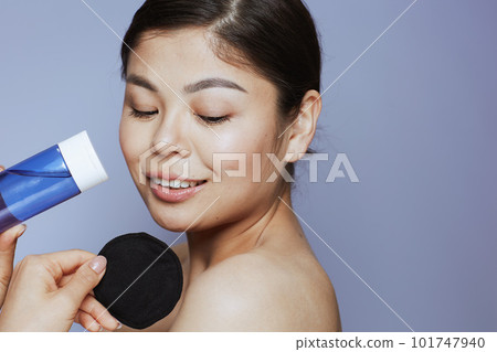 young asian woman with makeup remover young asian woman with makeup remover 101747940