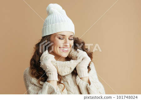 smiling elegant woman on beige background smiling elegant woman on beige background 101748024