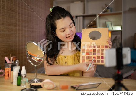 Beautiful women with social media influences recommend products and make-up accessories to be more beautiful, Recording vlog video live streaming, Online business of beauty bloggers. Beautiful women with social media influences recommend products and make-up accessories to be more beautiful, Recording vlog video live streaming, Online business of beauty bloggers. 101748439