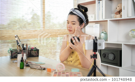 Beautiful women with social media influences are teaching makeup and use cosmetics, In front of the camera to recording vlog video live streaming, Online business on concept of beauty bloggers. 101748948
