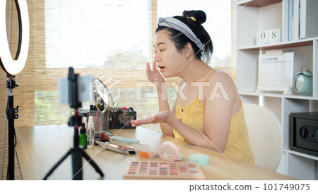 Beautiful women with social media influences are teaching makeup and use cosmetics, In front of the camera to recording vlog video live streaming, Online business on concept of beauty bloggers. 101749075