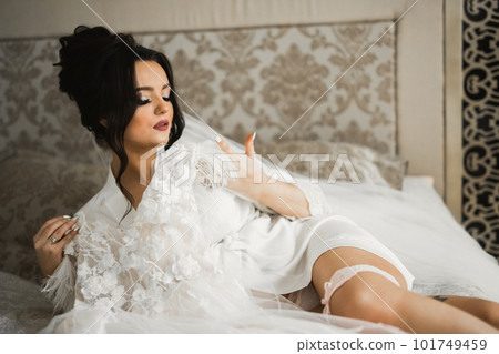 Portrait of a beautiful fashion bride, sweet and sensual. Wedding make up and hair Portrait of a beautiful fashion bride, sweet and sensual. Wedding make up and hair 101749459