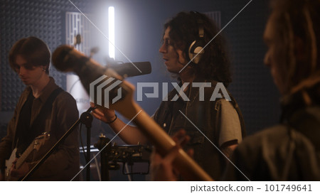 Professional vocalist uses audio mixer and sings 101749641