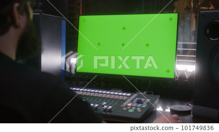 Sound engineer works on PC in music recording studio Sound engineer works on PC in music recording studio 101749836