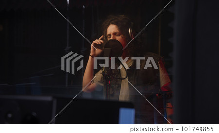 Musician sings song in soundproof room 101749855