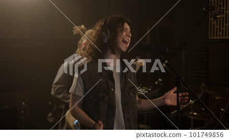 Vocalist makes visual moves and sings in studio 101749856