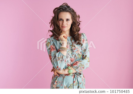 Portrait of modern woman with long wavy brunette hair on pink Portrait of modern woman with long wavy brunette hair on pink 101750485
