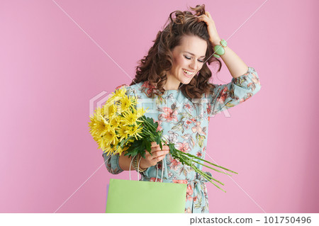happy elegant woman with long wavy brunette hair on pink 101750496