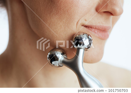 Closeup on young woman with massager 101750703